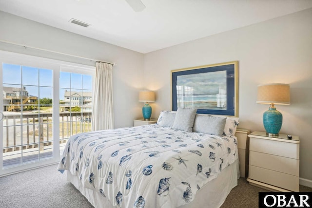 carpeted bedroom featuring ceiling fan, access to exterior, and visible vents