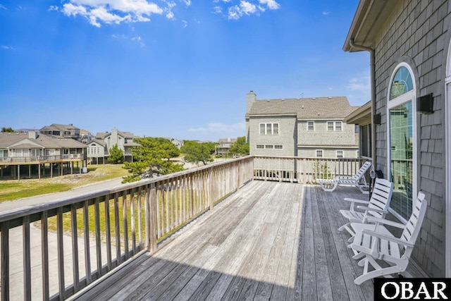wooden deck featuring a residential view