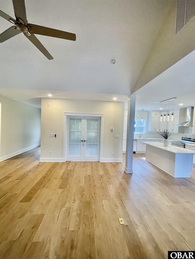 3009 Martins Point Rd Lot 3, Kitty Hawk, NC 27949 - unfurnished living room featuring a ceiling fan, baseboards, light wood-style floors, french doors, and recessed lighting
