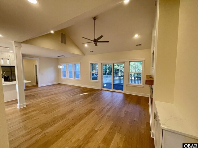 3009 Martins Point Rd Lot 3, Kitty Hawk, NC 27949 - unfurnished living room featuring ceiling fan, baseboards, high vaulted ceiling, plenty of natural light, and wood finished floors