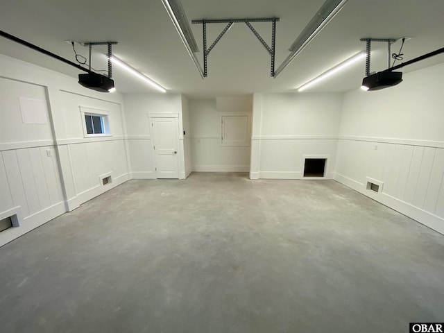 3009 Martins Point Rd Lot 3, Kitty Hawk, NC 27949 - garage featuring a garage door opener and wainscoting