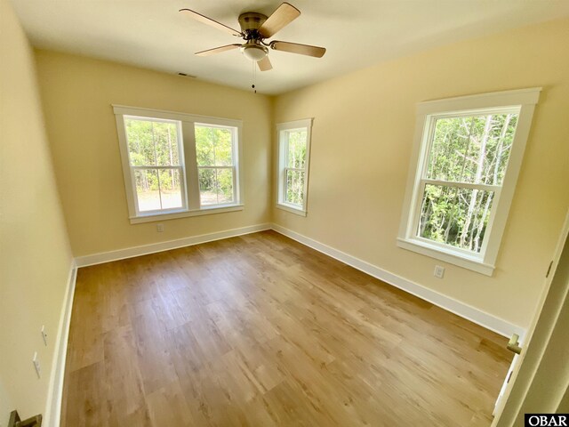 3009 Martins Point Rd Lot 3, Kitty Hawk, NC 27949 - empty room featuring wood finished floors, ceiling fan, and baseboards