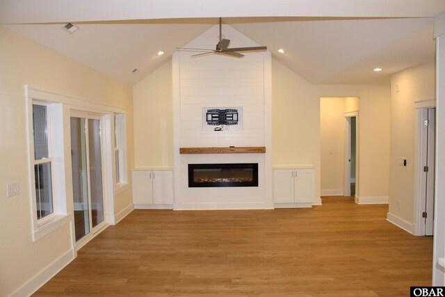 3009 Martins Point Rd Lot 3, Kitty Hawk, NC 27949 - unfurnished living room featuring light wood-type flooring, a fireplace, lofted ceiling, a ceiling fan, and baseboards