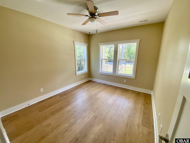3009 Martins Point Rd Lot 3, Kitty Hawk, NC 27949 - unfurnished room with wood finished floors, a ceiling fan, and baseboards