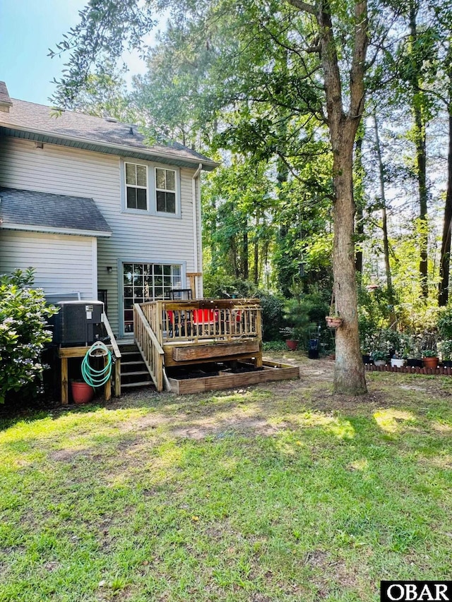 25 Croatan Ct Unit 25, Manteo, NC 27954 - rear view of property with a wooden deck, a yard, and cooling unit