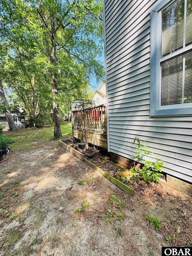 25 Croatan Ct Unit 25, Manteo, NC 27954 - view of yard with a deck