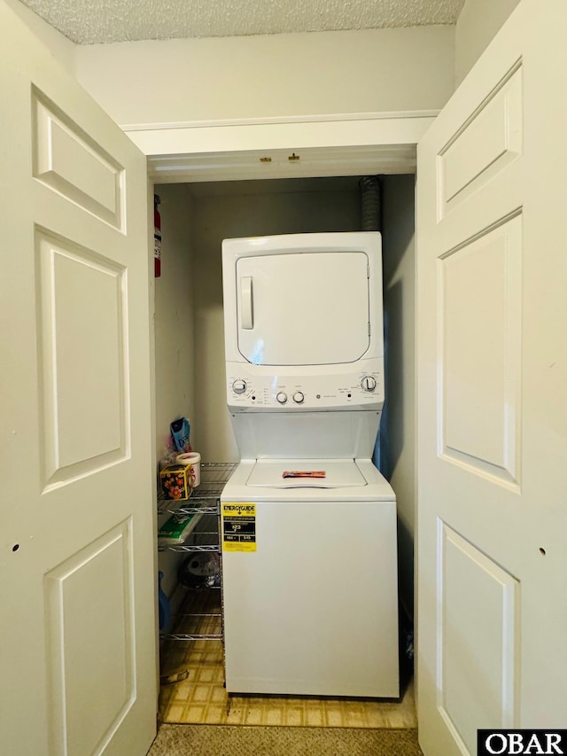 25 Croatan Ct Unit 25, Manteo, NC 27954 - laundry room featuring estacked washer and dryer and light floors