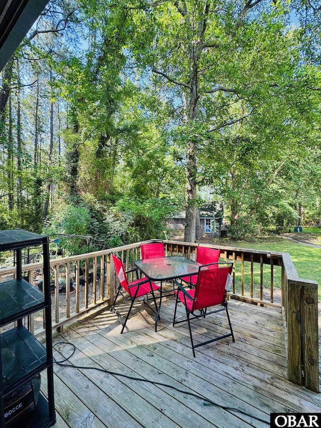 25 Croatan Ct Unit 25, Manteo, NC 27954 - wooden deck featuring outdoor dining space