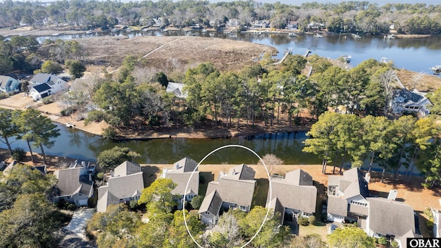 drone / aerial view with a residential view and a water view