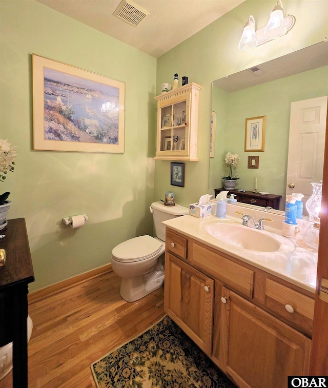 126 Baum Bay Dr Lot B, Kill Devil Hills, NC 27948 - bathroom featuring wood finished floors, vanity, and toilet