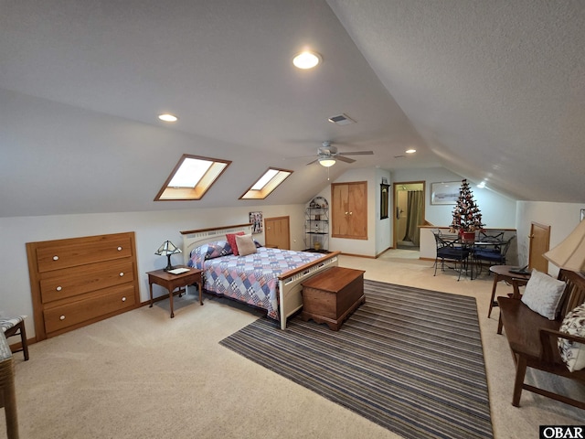 126 Baum Bay Dr Lot B, Kill Devil Hills, NC 27948 - bedroom with light colored carpet, a skylight, vaulted ceiling, recessed lighting, and a ceiling fan