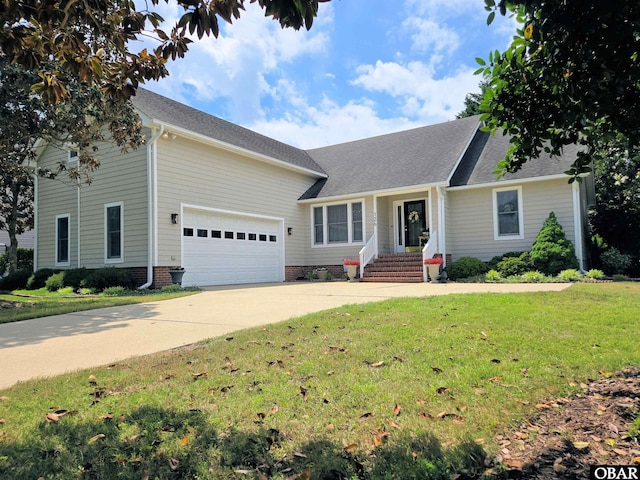 126 Baum Bay Dr Lot B, Kill Devil Hills, NC 27948 - view of front facade with driveway, an attached garage, and a front yard