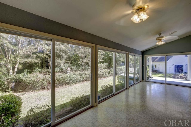 unfurnished sunroom with lofted ceiling and ceiling fan