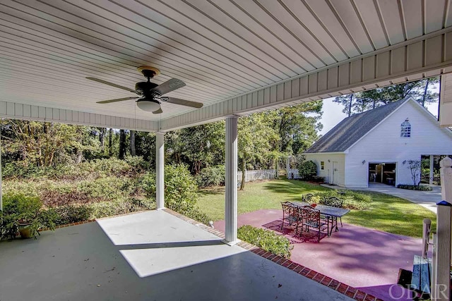 view of patio / terrace with outdoor dining area, fence, and a ceiling fan