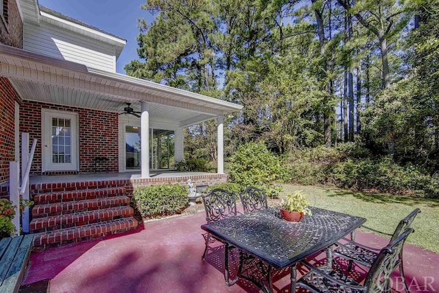 view of patio / terrace featuring a ceiling fan and outdoor dining space