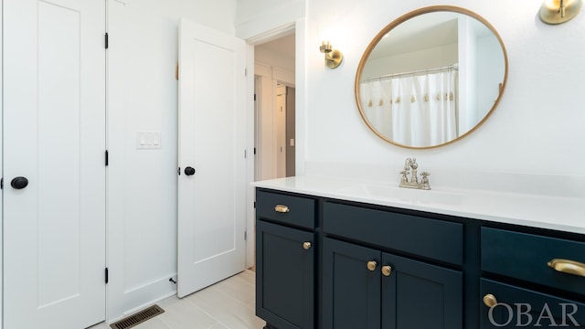 full bathroom with visible vents and vanity