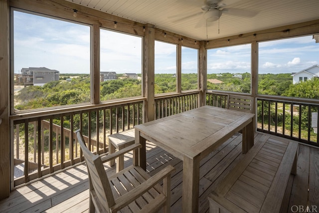 deck featuring ceiling fan and outdoor dining area