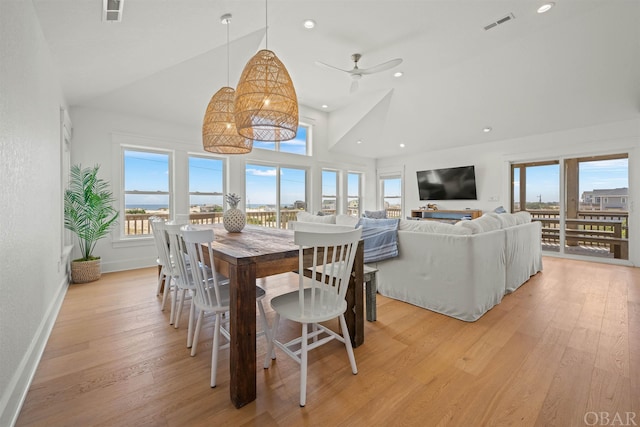 dining room with light wood-style floors, baseboards, and visible vents