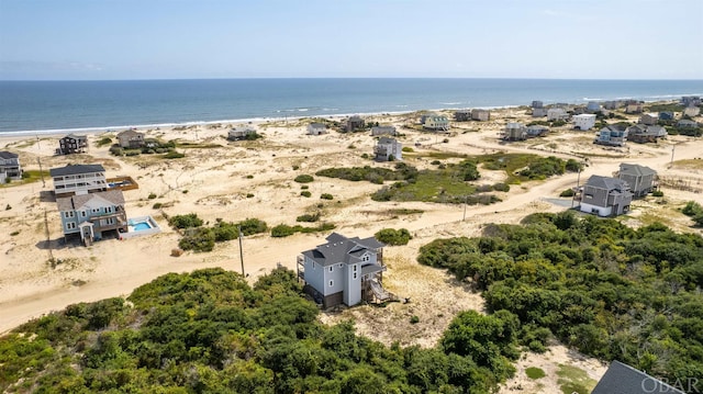 aerial view featuring a water view and a view of the beach