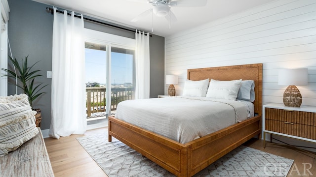 bedroom featuring light wood-type flooring, access to outside, and ceiling fan