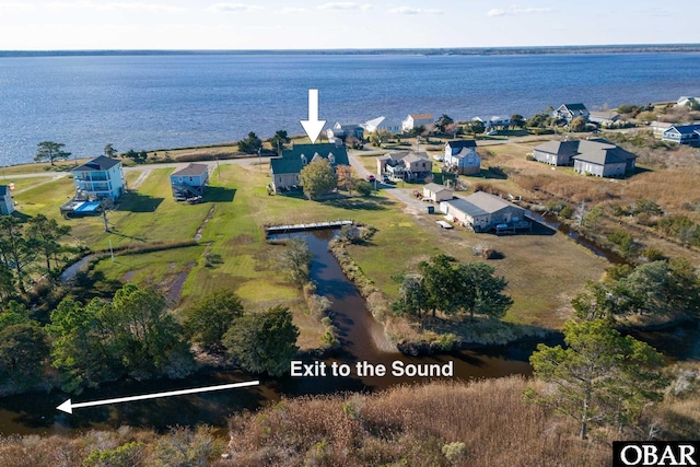 bird's eye view with a water view and a residential view