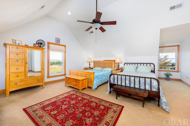 bedroom featuring lofted ceiling, visible vents, and baseboards