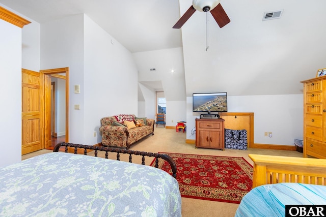 bedroom featuring baseboards, high vaulted ceiling, visible vents, and light colored carpet