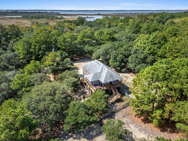 birds eye view of property with a wooded view