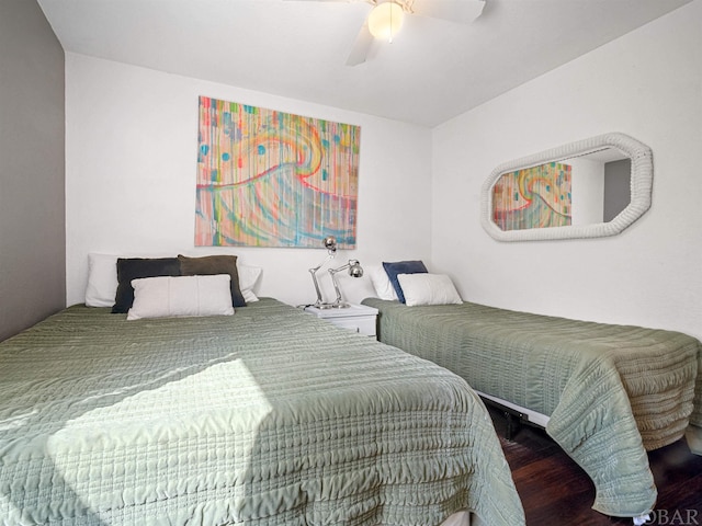 bedroom featuring dark wood-style floors and a ceiling fan