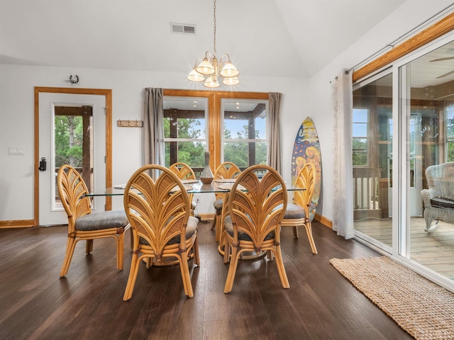 dining area with baseboards, visible vents, lofted ceiling, dark wood-style floors, and an inviting chandelier