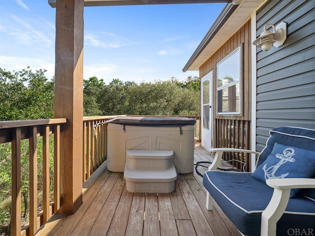 wooden terrace featuring a hot tub