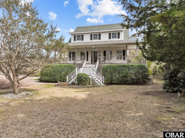 view of front of property with a porch and stairway