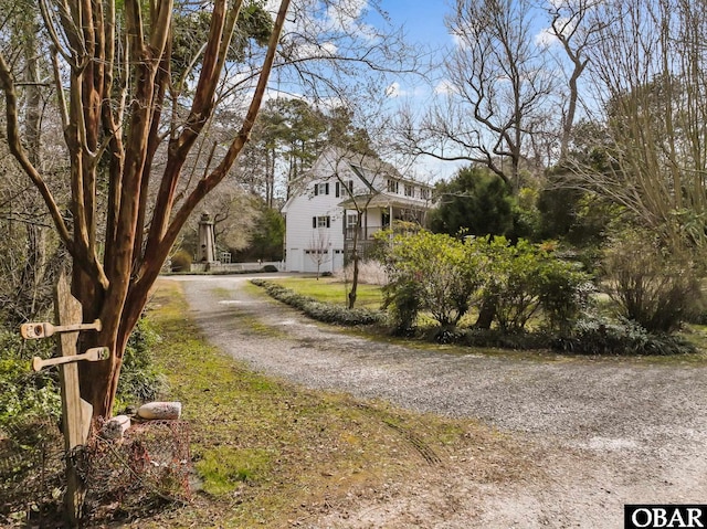 view of road with driveway