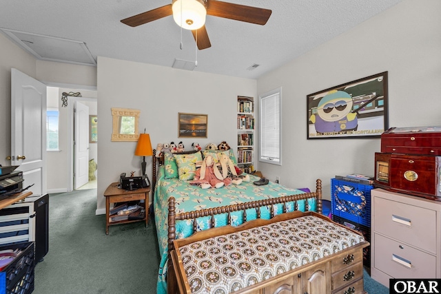 409 W Raceview Ct Lot # 35, Nags Head, NC 27959 - carpeted bedroom with attic access, a ceiling fan, and a textured ceiling