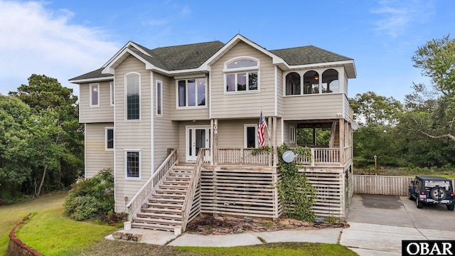 409 W Raceview Ct Lot # 35, Nags Head, NC 27959 - view of front of property with stairway, roof with shingles, and covered porch