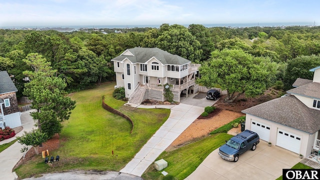 409 W Raceview Ct Lot # 35, Nags Head, NC 27959 - aerial view of property and surrounding area featuring a heavily wooded area