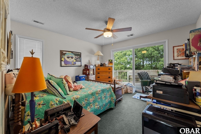 409 W Raceview Ct Lot # 35, Nags Head, NC 27959 - carpeted bedroom featuring access to exterior, a textured ceiling, and ceiling fan