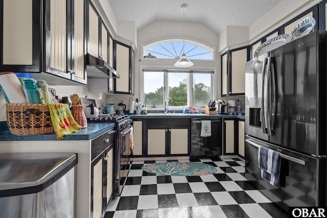 409 W Raceview Ct Lot # 35, Nags Head, NC 27959 - kitchen featuring fridge with ice dispenser, dishwashing machine, dark countertops, gas range, and under cabinet range hood
