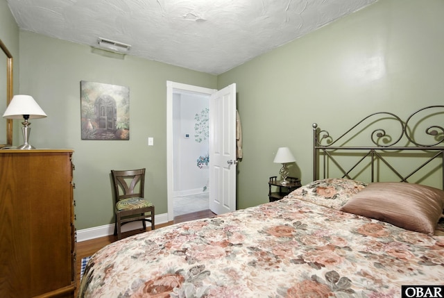 401 E Queen St, Edenton, NC 27932 - bedroom with wood finished floors and baseboards