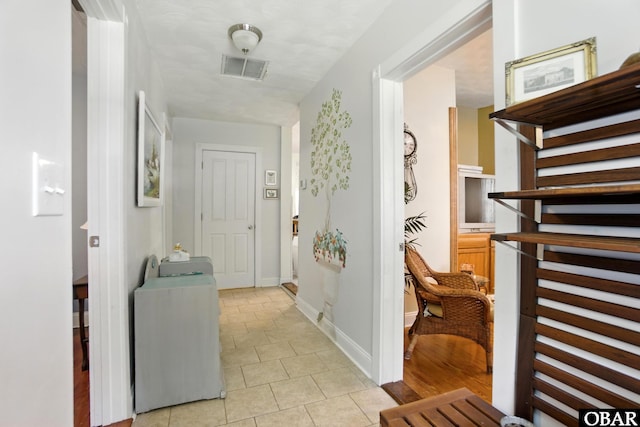 401 E Queen St, Edenton, NC 27932 - corridor with light tile patterned floors and stairway