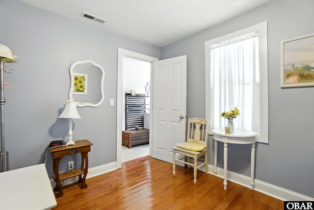 401 E Queen St, Edenton, NC 27932 - sitting room with baseboards and wood finished floors