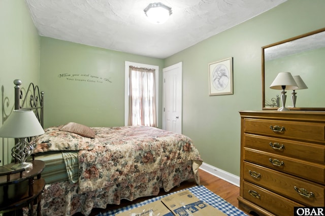 401 E Queen St, Edenton, NC 27932 - bedroom with wood finished floors and baseboards