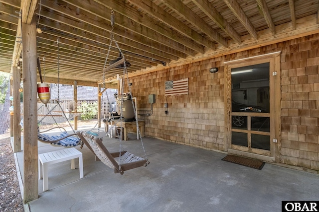 miscellaneous room with unfinished concrete flooring