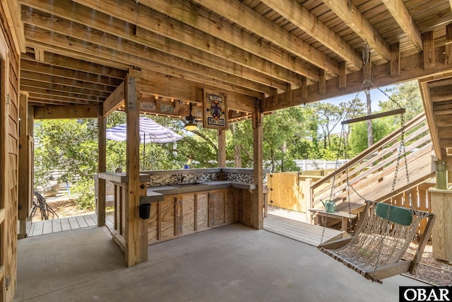 view of patio with outdoor dry bar
