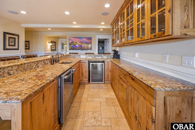 1459 Ocean Pearl Rd Lot 2, 3A, 3B, Corolla, NC 27927 - kitchen with beverage cooler, dishwasher, stone tile floors, a peninsula, and brown cabinetry