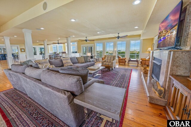 1459 Ocean Pearl Rd Lot 2, 3A, 3B, Corolla, NC 27927 - living area with decorative columns, light wood finished floors, ceiling fan, a fireplace, and recessed lighting