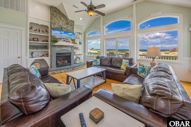 1459 Ocean Pearl Rd Lot 2, 3A, 3B, Corolla, NC 27927 - living room featuring wood finished floors, vaulted ceiling, built in shelves, and plenty of natural light