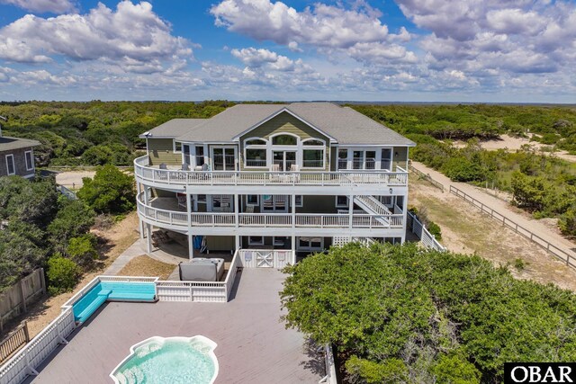 1459 Ocean Pearl Rd Lot 2, 3A, 3B, Corolla, NC 27927 - back of house featuring a deck, a fenced backyard, and an outdoor pool