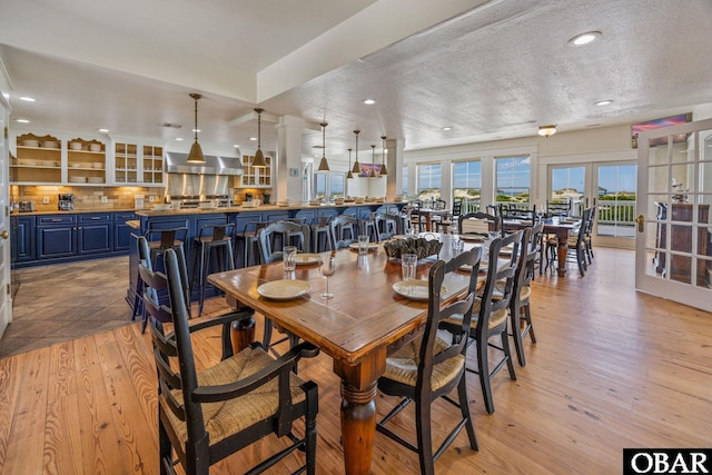 1459 Ocean Pearl Rd Lot 2, 3A, 3B, Corolla, NC 27927 - dining room featuring light wood-type flooring, recessed lighting, a textured ceiling, and french doors