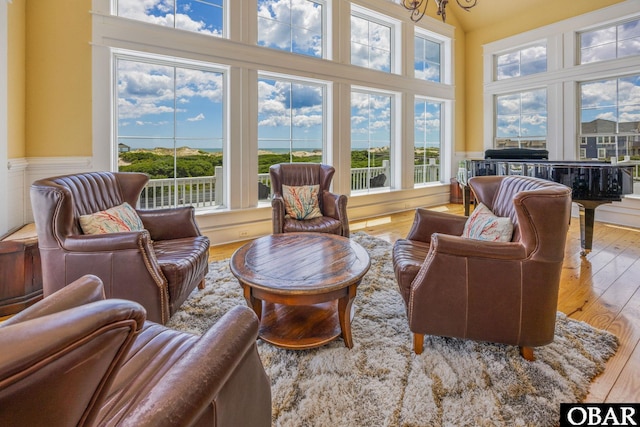 1459 Ocean Pearl Rd Lot 2, 3A, 3B, Corolla, NC 27927 - living area with wood finished floors, a wainscoted wall, and a high ceiling